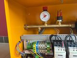 a yellow box that has some electrical equipment inside of it