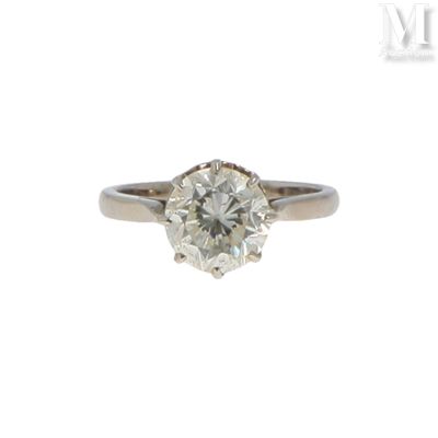 Bague diamant Bague en or gris 18K (750°/°°) centrée d'un di…