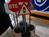 a stop sign and a traffic sign on a wooden stand