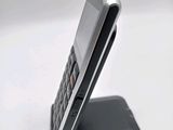 a cell phone that is sitting on top of a stand