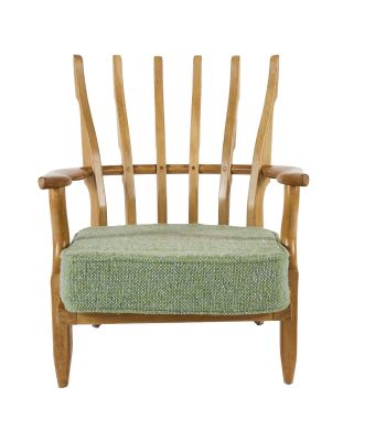 chair made of wood and fabric with a green seat pad