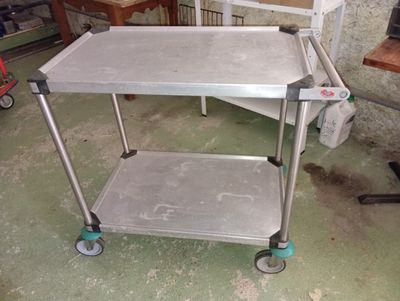 a metal cart that is sitting on the floor