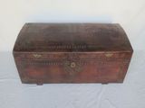 an old wooden trunk with a metal latch on the top
