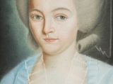 portrait of a woman in a blue dress with a crown on her head