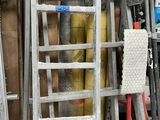 a ladder leaning against a wall in a garage