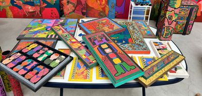 a table that has a lot of art on it