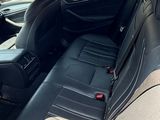 the back seats of a car are empty in a parking lot