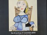 a poster with a picture of a woman in a blue dress