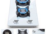 four different views of a gas stove with blue flames