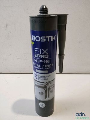 a close up of a bottle of fix and fix glue on a table