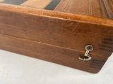 a wooden box that has a lock on it