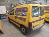 a yellow van that is parked in a garage