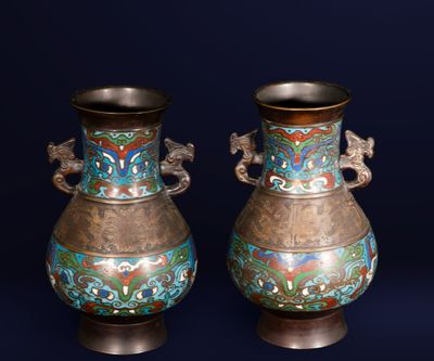two vases that are sitting side by side on a blue background