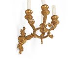 an image of a pair of antique brass wall sconces on a white background