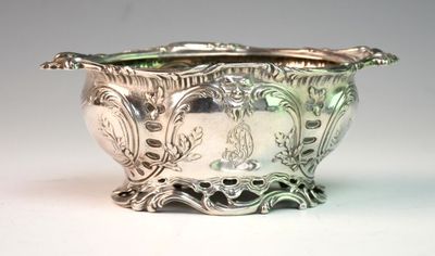 a silver bowl that is sitting on a table