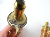 a person holding a brass object in their hand