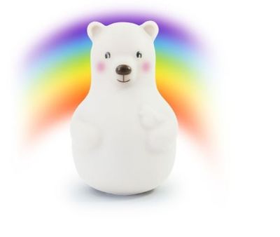 un petit ours polaire blanc avec un arc-en-ciel en arrière-plan