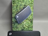an image of a black speaker sitting on top of a box