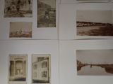 many old photos of people and buildings on the wall