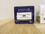 two boxes of soap sitting on top of a table next to each other