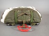 a duffel bag and a pair of scissors on the floor