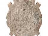 an image of a stone object on a white surface
