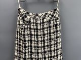 a black and white skirt hanging on a hanger