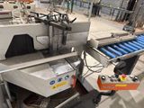 an image of a machine that is working on a conveyor belt
