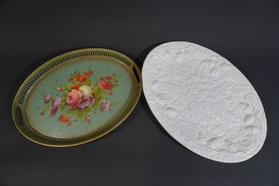 two plates that have flowers on them on a table