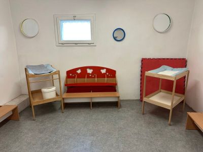 a room with a bed, a couch, and a table