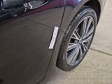 a close up of a car door with a sticker on it