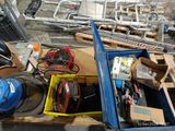 a box full of assorted electrical equipment on a pallet