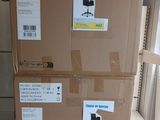 boxes are stacked on top of each other in a room