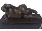 bronze sculpture of a woman laying on a marble base