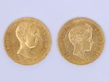 a close up of two gold coins with a woman ' s head on them