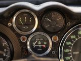 a close up of a car dashboard with various gauges