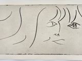a drawing of a woman ' s face on a piece of paper