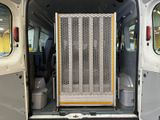 a white van with the door open and the back door open