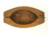 a wooden box with a carved design on it