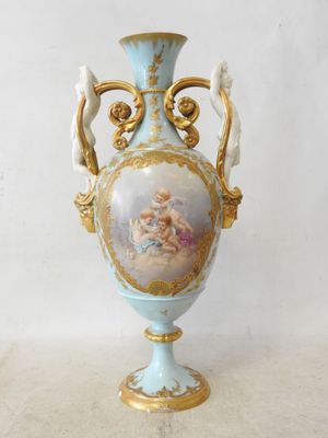 a vase that has a picture of a woman on it
