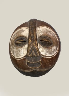 an image of a brown and white mask on a white background
