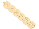 a close up of a gold bracelet on a white background