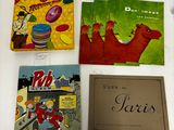 three children ' s books are sitting on a white surface
