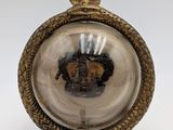 an image of a gold and silver clock with a crown on it