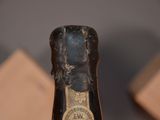 a close up of a bottle of wine on a table
