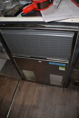 a stove top oven sitting on top of a kitchen counter