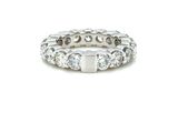 a close up of a diamond ring on a white background