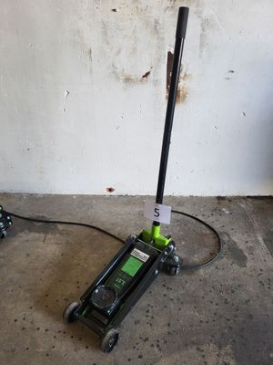 a pair of jacks sitting on the floor next to a wall