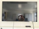 a man taking a picture of himself in the mirror