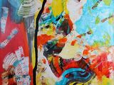 une peinture accrochée au mur d'une pièce, réalisée avec plusieurs couleurs de peinture